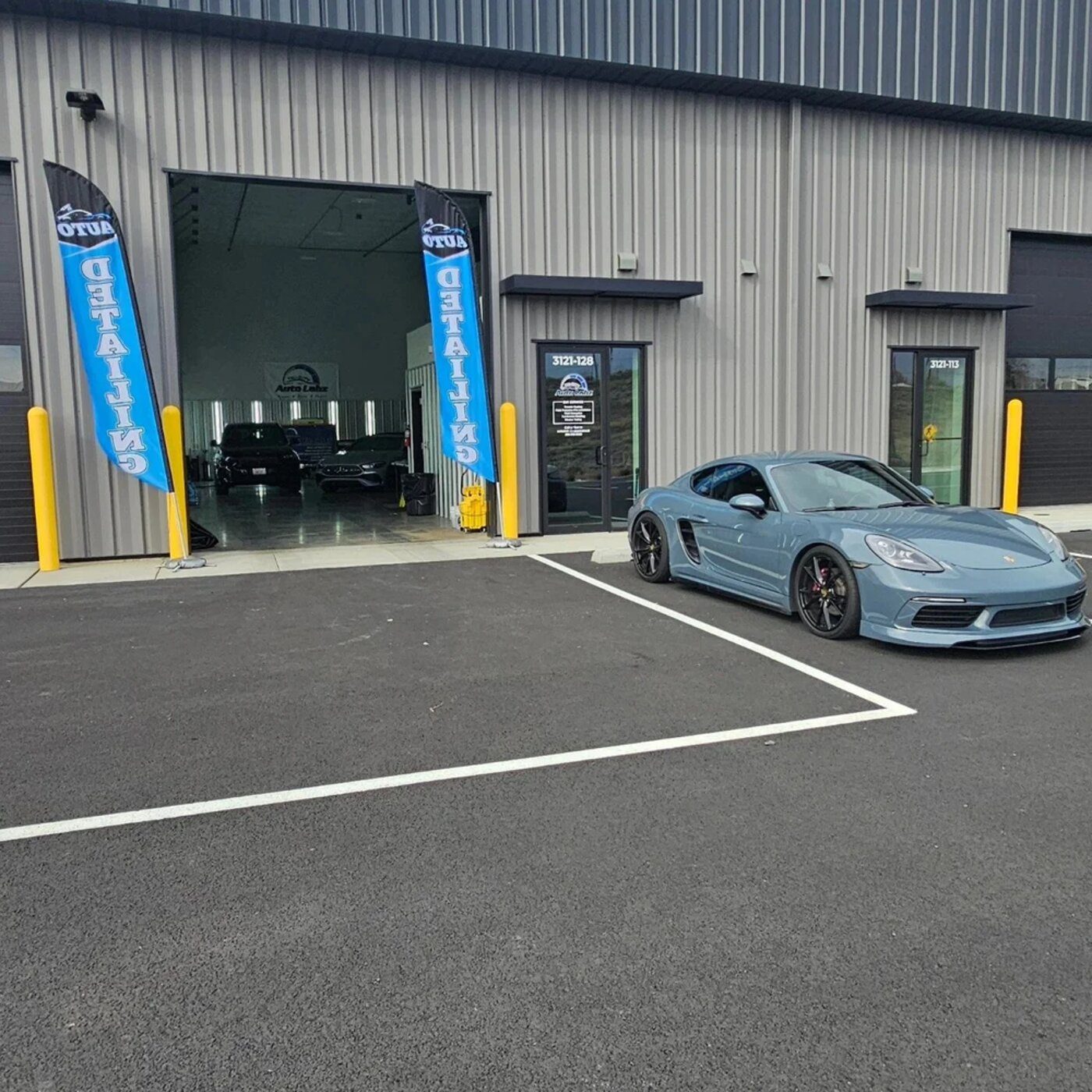 Tri City Auto Labz shop exterior with a Porsche 718 out front